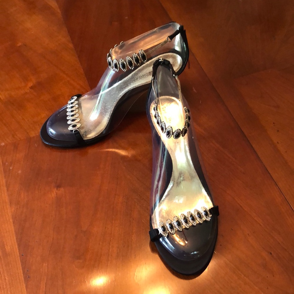 Black satin sandals with metal accents